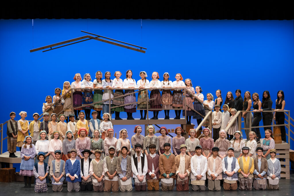 CDM High performing on stage in Fiddler on the Roof, theatre photography by Art of Portraits, dramatic lighting and expressive portrait